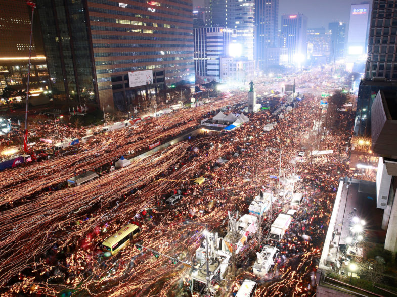 People march toward the Presidential Blue House during a protest calling for Park Geun-hye to step down in central 